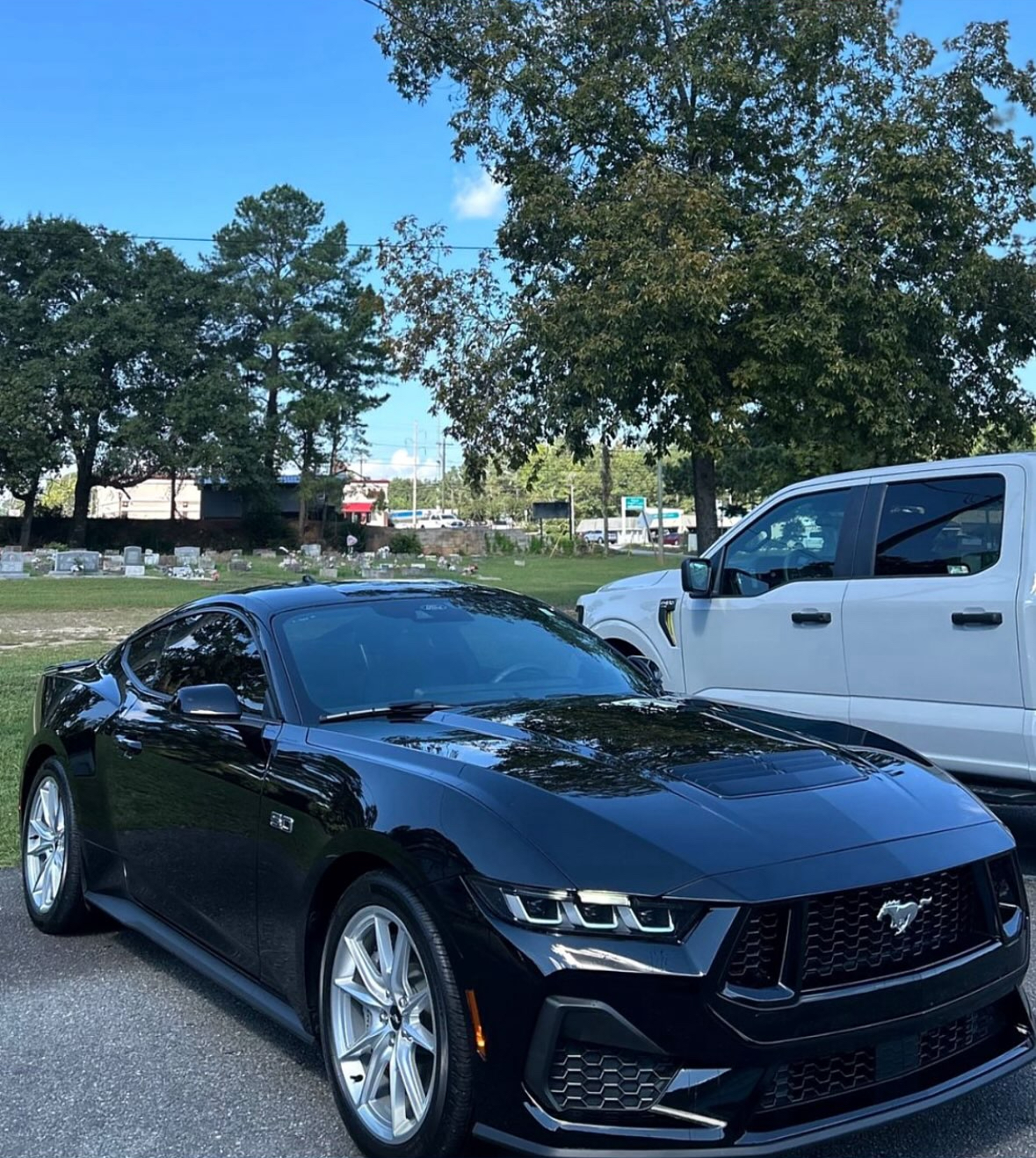 Glossy black Ford Mustang after exterior detailing